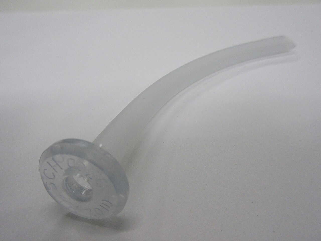 Curved nasopharyngeal airway with a flange at the nostril end