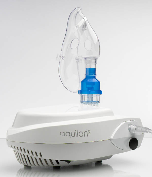 Jet nebulizer cup with adult facemask on an electric compressor unit